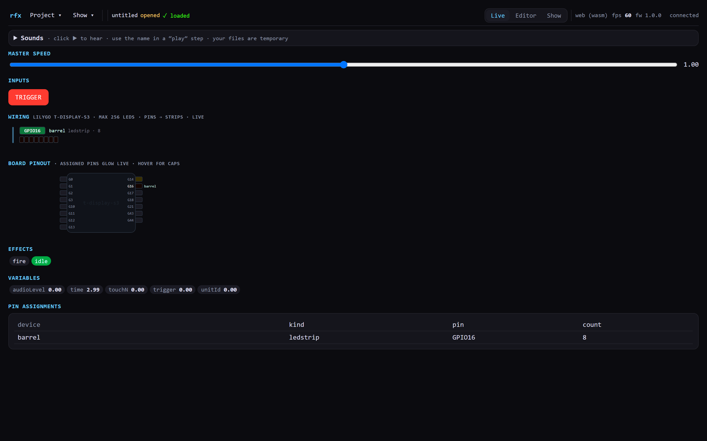 The Live tab showing Master Speed at 1.00, an Inputs row with a red TRIGGER button, a Wiring section listing GPIO16 barrel ledstrip with eight pixels, a board pinout diagram of the t-display-s3 with G16 highlighted, an Effects row showing 'fire' and 'idle' with idle lit, a Variables row, and a pin assignments table.